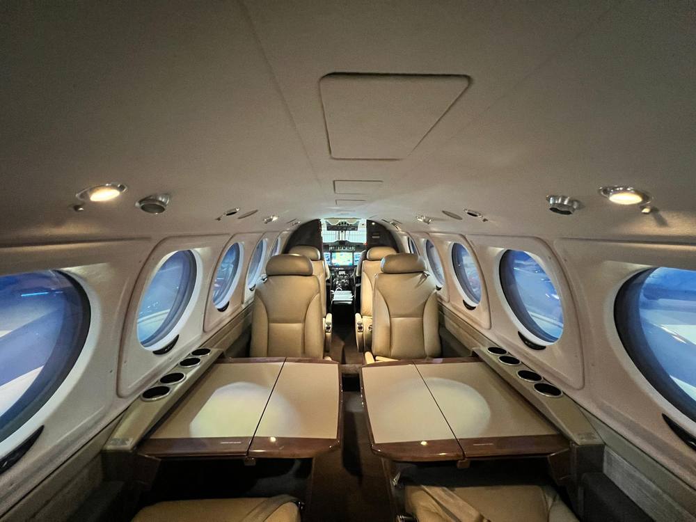Cabin with pedestal seats and executive tables