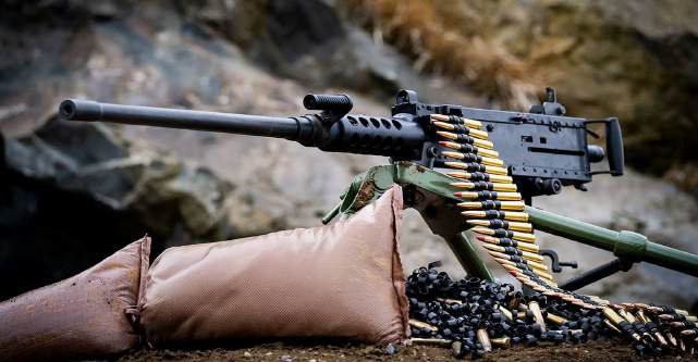 Belt-fed machine gun on a sandbag
